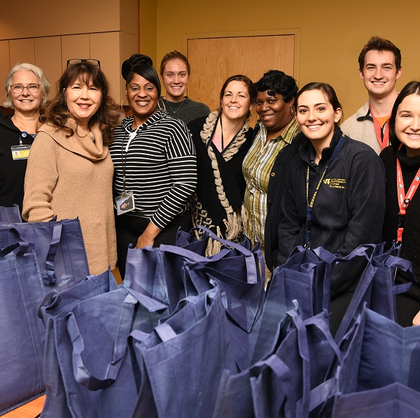 11th St. and CNHP staff, faculty, students and volunteers preparing Turkey Drive bags